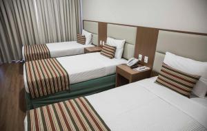 Кровать или кровати в номере Mirador Rio Copacabana Hotel