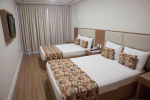 Кровать или кровати в номере Mirador Rio Copacabana Hotel