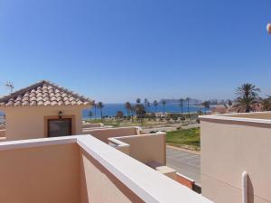 a view of the ocean from the balcony of a building at Duplex 8 in Puerto de Mazarrón
