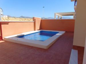 a hot tub on the roof of a house at Duplex 8 in Puerto de Mazarrón