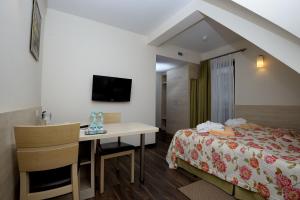 Postel nebo postele na pokoji v ubytování Hotel Nad Przełomem
