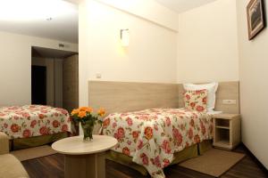 Postel nebo postele na pokoji v ubytování Hotel Nad Przełomem