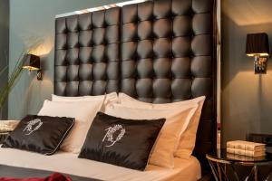 Postel nebo postele na pokoji v ubytování Heritage Hotel 19