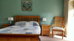 מיטה או מיטות בחדר ב-The Bell House