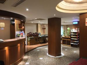 a lobby with a bar and a counter in a store at Fu Chang Hotel in Taipei