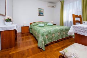 Postel nebo postele na pokoji v ubytování Rooms Stefania