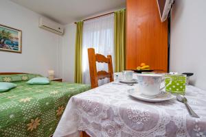 Postel nebo postele na pokoji v ubytování Rooms Stefania