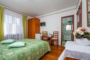 Postel nebo postele na pokoji v ubytování Rooms Stefania