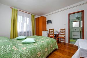 Postel nebo postele na pokoji v ubytování Rooms Stefania