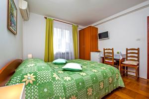 Postel nebo postele na pokoji v ubytování Rooms Stefania