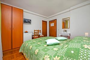 Postel nebo postele na pokoji v ubytování Rooms Stefania