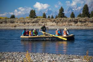 people on a small boat in the water at Jackson Lake Lodge in Moran