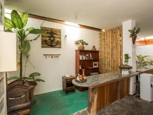 a living room with a table and some plants at Galapagos Dreams in Puerto Ayora