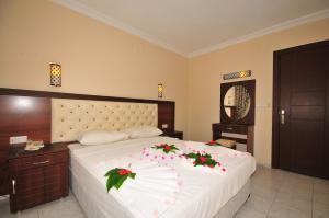 Кровать или кровати в номере Ozturk Apart Hotel