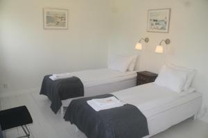 Rúm í herbergi á Alvaret Hotel & Hostel