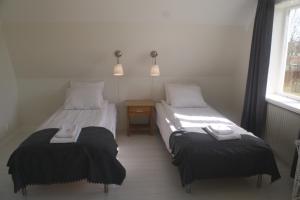 Rúm í herbergi á Alvaret Hotel & Hostel