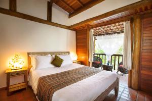 Giường trong phòng chung tại Smart Hotel Pousada Reserva Camburi