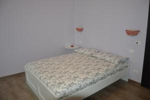 Postel nebo postele na pokoji v ubytování B&B Maison Blanche