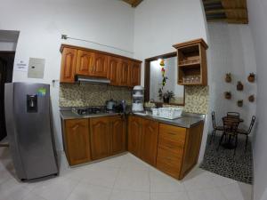 Kuchyň nebo kuchyňský kout v ubytování Fami Hotel Vive Jardin
