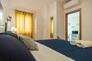 Ένα ή περισσότερα κρεβάτια σε δωμάτιο στο Le Mura Del Borgo
