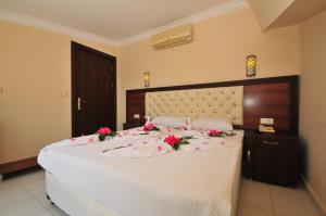 Кровать или кровати в номере Ozturk Apart Hotel