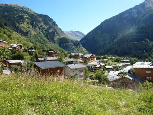 a small town in a valley with mountains at Les Glières - Champagny-en-Vanoise in Champagny-en-Vanoise