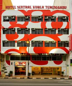 a hotel with a red and white building at Hotel Sentral Kuala Terengganu in Kuala Terengganu