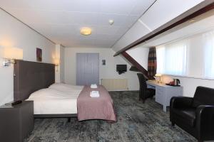 Postel nebo postele na pokoji v ubytování Hotel Cafe Restaurant Duinzicht
