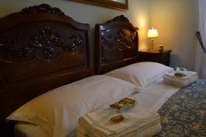 Postel nebo postele na pokoji v ubytování B&B Palazzo La Loggia