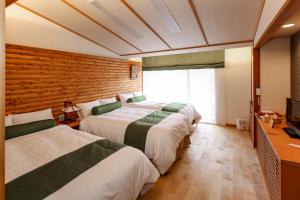 Cama ou camas em um quarto em Hotel Fuki no Mori