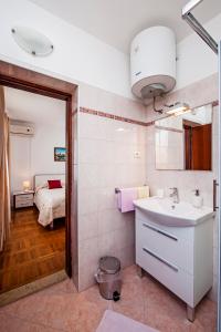 Postel nebo postele na pokoji v ubytování Rooms Stefania