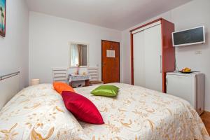 Postel nebo postele na pokoji v ubytování Rooms Stefania