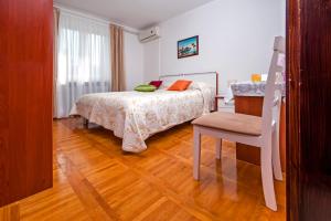Postel nebo postele na pokoji v ubytování Rooms Stefania