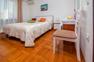 Postel nebo postele na pokoji v ubytování Rooms Stefania