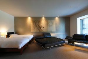 Postel nebo postele na pokoji v ubytování Aoi Hotel Kyoto