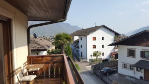 a balcony of a house with a view of a street at SonnenApartment in Lana