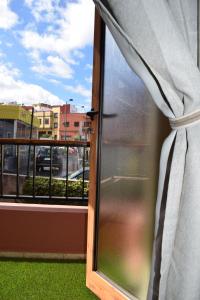 a window with a view of a city at Apartamento San Isidro in La Orotava