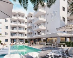 una imagen del exterior de un edificio con piscina en White Apartments - Adults Only en Ibiza
