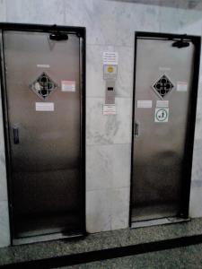 two elevators in a subway station with their doors open at Copacabana POSTO 4 Temporada in Copacabana