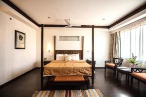 Un pat sau paturi într-o cameră la Southern Star,Mysore