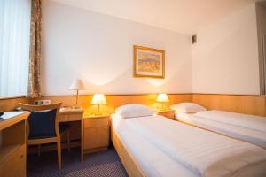 Letto o letti in una camera di Parkhotel Styria
