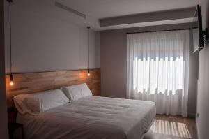 Posteľ alebo postele v izbe v ubytovaní Hotelet de Sant joan