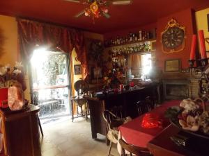 a room with a bar and a table and a window at Home Story in Ozzano dell'Emilia