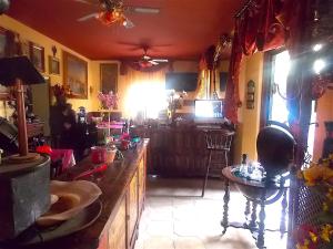 a living room with a table and a television at Home Story in Ozzano dell'Emilia