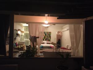 A bed or beds in a room at Kenting Sun Light Inn