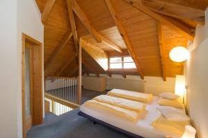 a bedroom with two beds in a attic at Haus Romen in Appiano sulla Strada del Vino