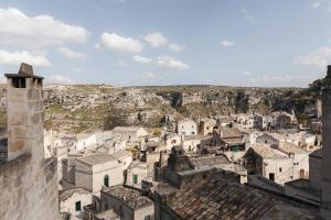 a view of a city from the castle at Angolo del Poeta - Maison de Charme in Matera