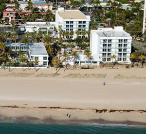 an aerial view of a beach with buildings at Plunge Beach Resort in Fort Lauderdale