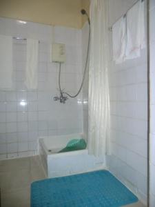 Ett badrum på Fang Fang Hotel