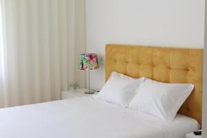 Lova arba lovos apgyvendinimo įstaigoje Bracara Guest House "Mosteiro" - "Falperra"
